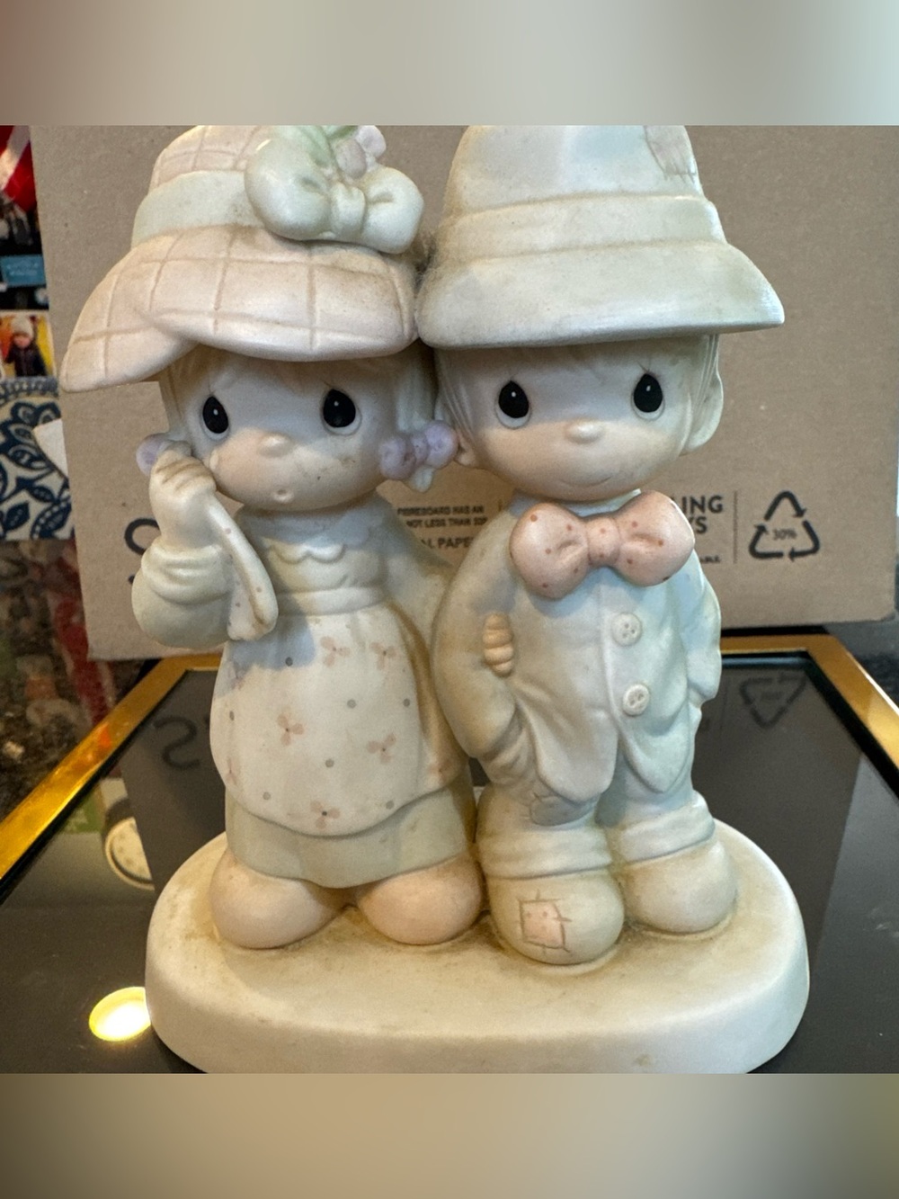 Precious Moments  “God Bless Our Family” #100498 is retired/discontinued.